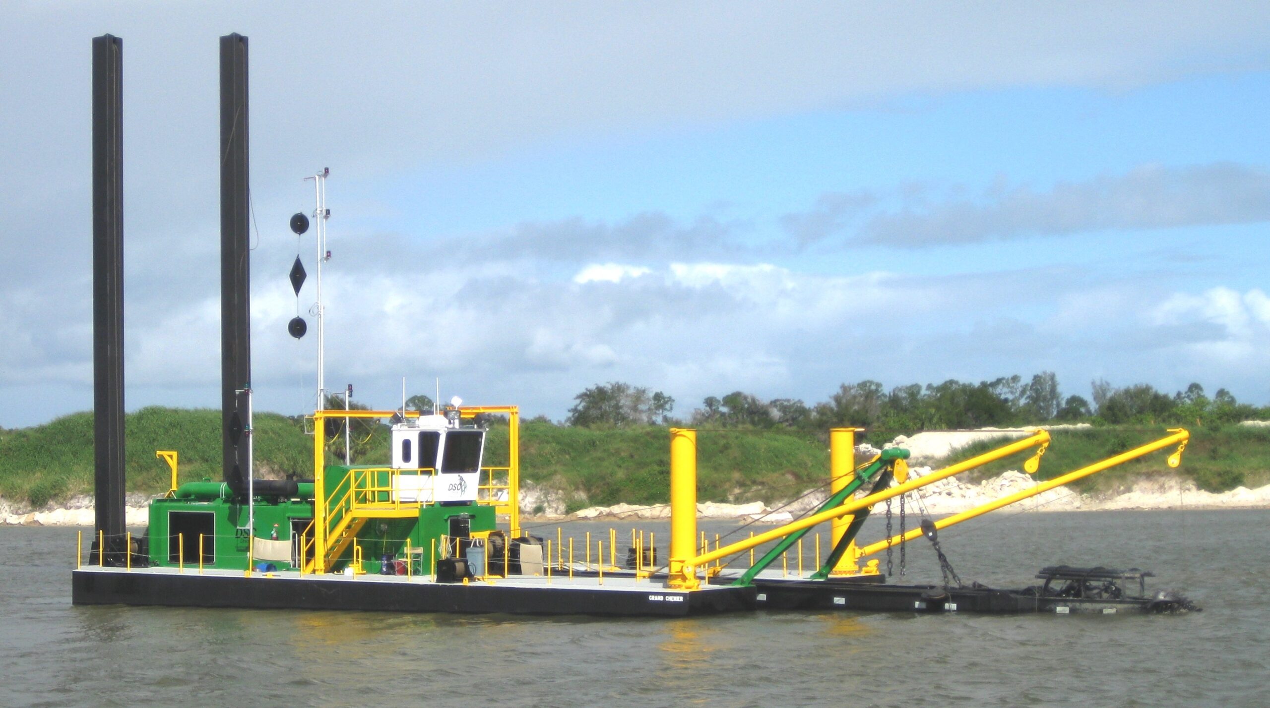 Spud-barge cutter dredge working an inlet
